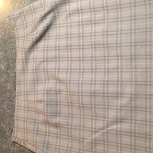 Beige and black check lined skirt.